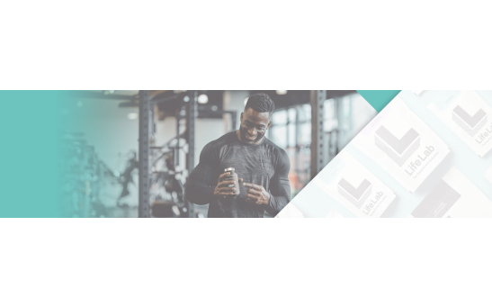 Man holding Stak Pack Bottle in gym, happy with his product
